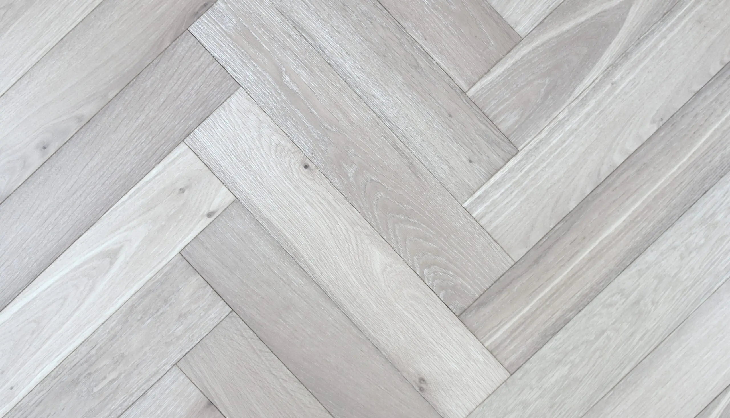 Limed Grey Oak AC4 Laminate Herringbone Parquet