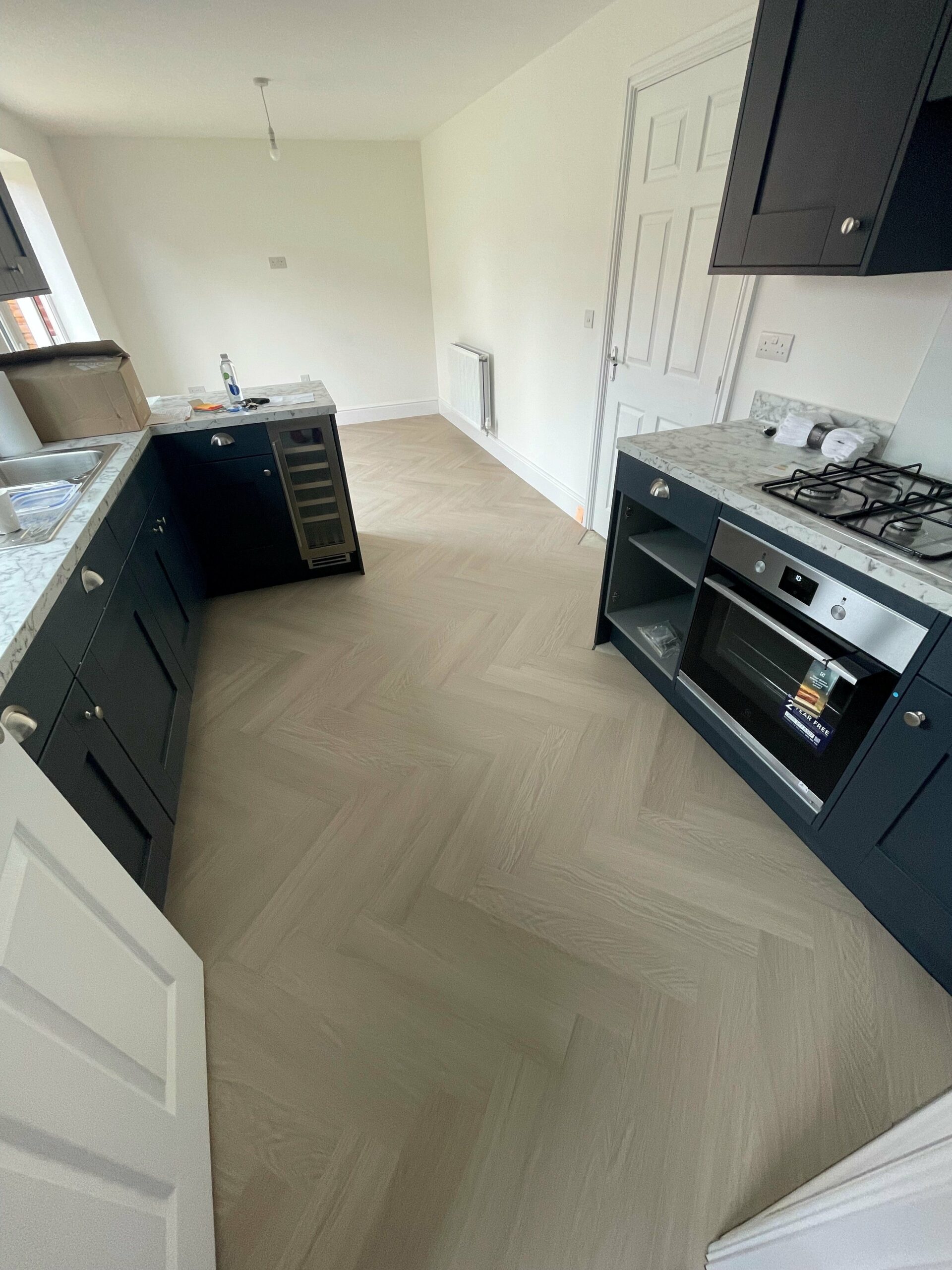 Alabaster White Oak Impervia Herringbone Parquet