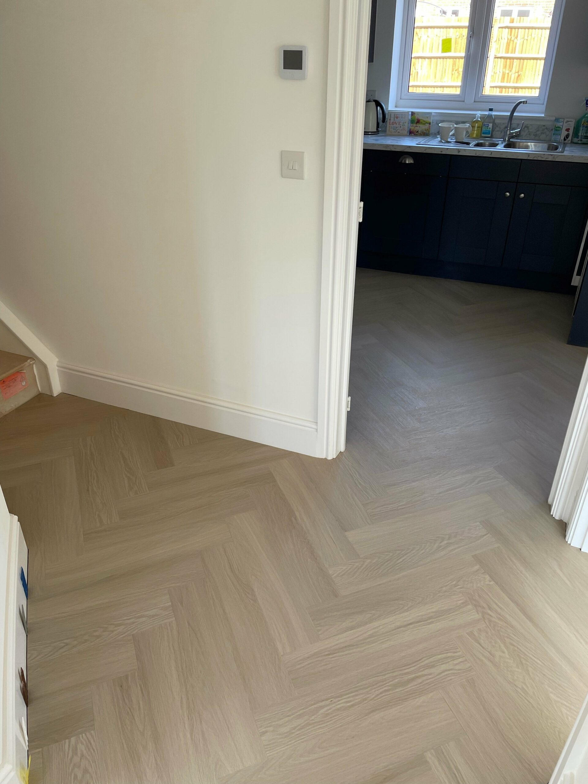 Alabaster White Oak Impervia Herringbone Parquet