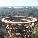 Spiral treetop walkway surrounds Danish forest